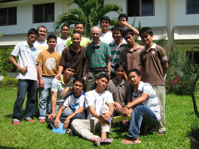 Fr. P.J. McGuire (middle) with students at the 2009 final vows program in the Philippines. 