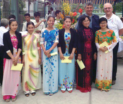 Fr. Bernie with teachers during a visit to the Vietnamese District