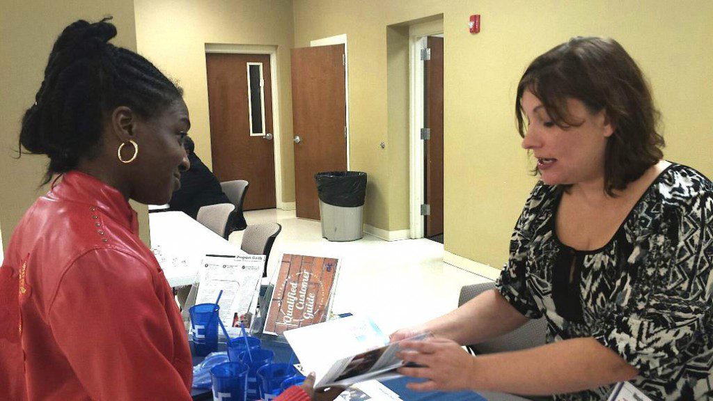 A participant receives information at the SHSM-MCH Housing Resource Fair (photo: Henry Bailey of the DeSoto Times-Tribune)