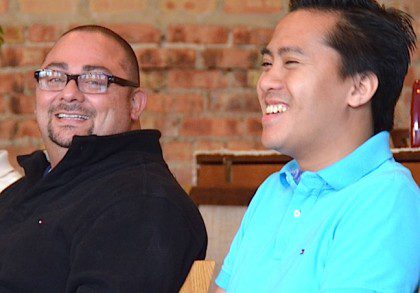 Alonso Barrantes and Fra. James Nguyen during a community meeting in Chicago.