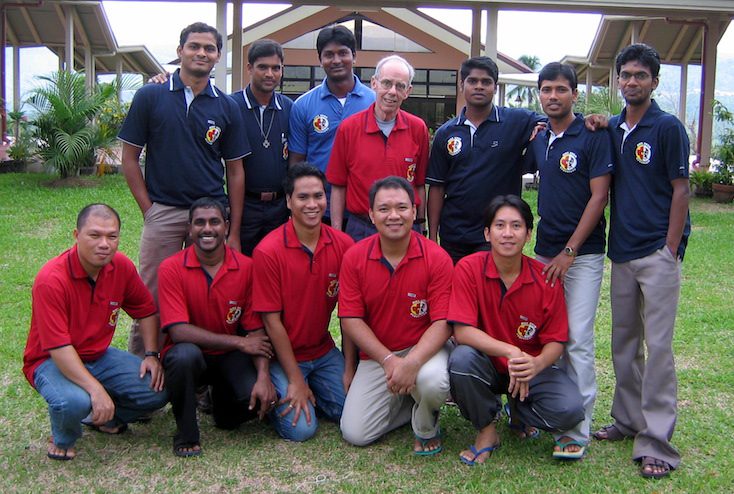 Fr. PJ and students in Asia