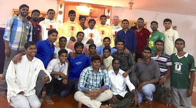 Newly ordained SCJs visit with one of the Indian formation communities