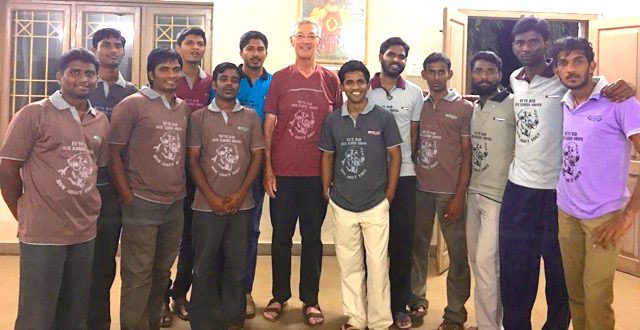Fr. Cassidy and students in India with their "club" shirts