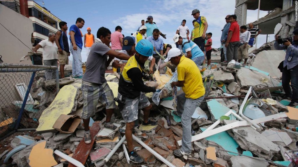 Workers clear rubble in Ecuador following an earthquake (CNN photo)