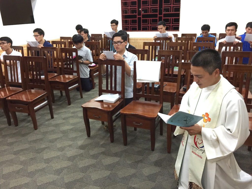 Fr. Francis leads prayer with students in Vietnam