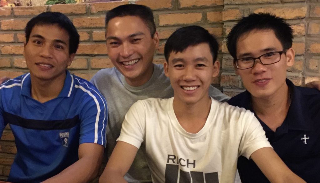 Fr. Francis (second from left) in a "selfie" with students in Vietnam earlier this year