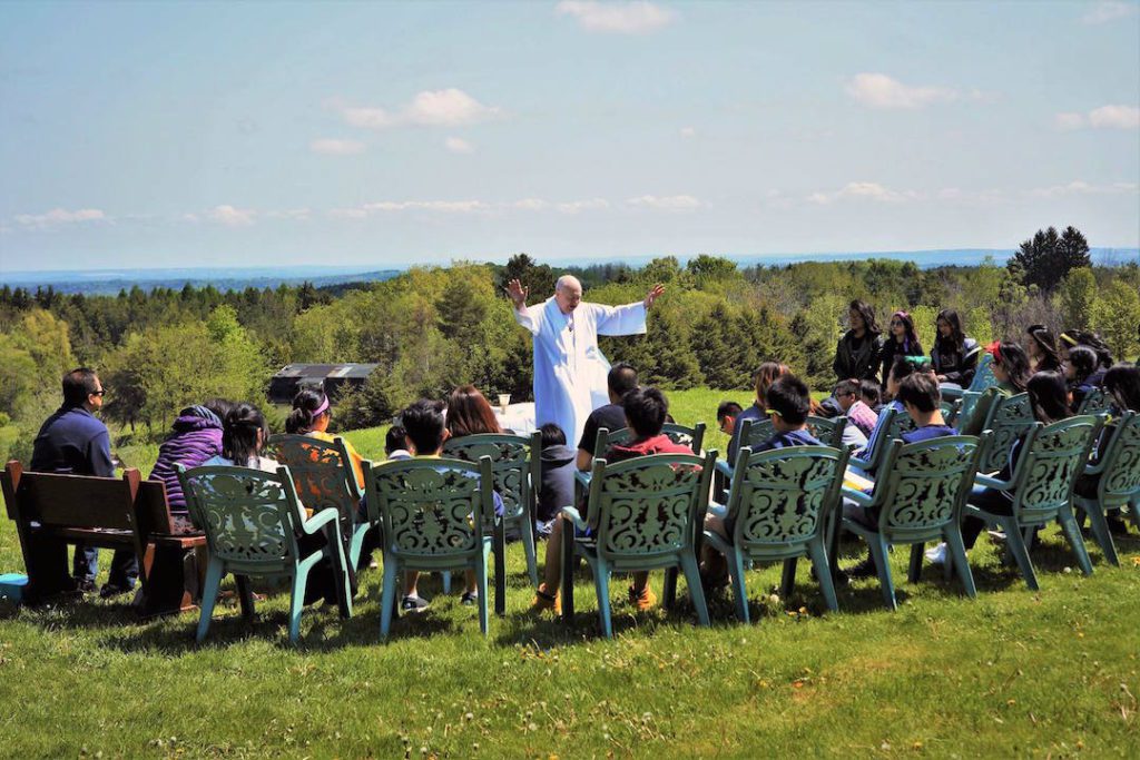 Fr. Peter McKenna leads an outdoor prayer service