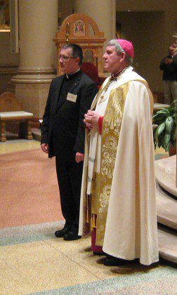 Fr. Wayne Jenkins stands next to Archbishop Jerome Listecki during Milwaukee's Vatican II awards ceremony.