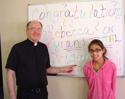 Fr. Stephen Huffstetter with Rebecca, a student at St. Joseph's Indian School who earned a laptop by collecting soup labels. Fr. Steve is now preparing to say good bye to St. Joe's and its students and staff.