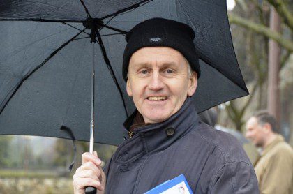In true Londoner style, Fr. Hugh Hanley poses under an umbrella