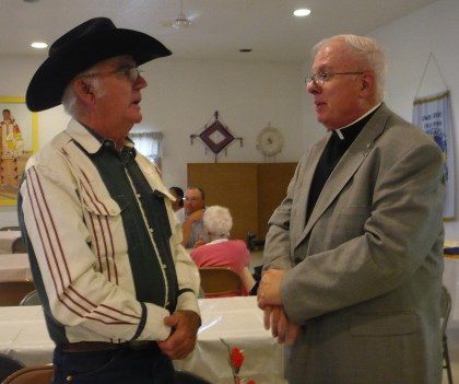 Fr. Joe Dean with a parishioner after Mass. The Lower Brule Pastoral Team ministers to a mix of Native American and rural ranching communities in central South Dakota. 