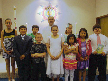 Fr. Hendrik with First Communion recipients at St. Mary's in Lower Brule last year.