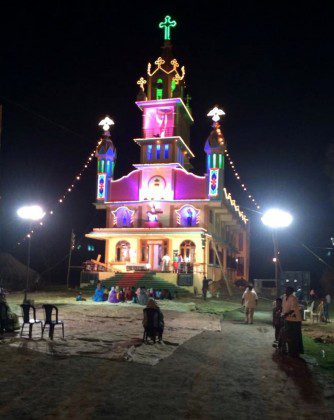 Sacred Heart Church in Nambur lighted up the night before the celebration while  parishioners get ready.