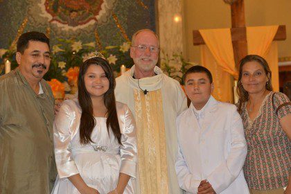 Fr. Ed Kilianski with newly baptized members of OLG, Houston