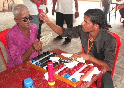 A parishioner at Divine Mercy near Mumbai receives an eye exam