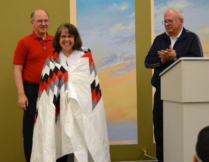 Sr. Cathy receives a star quilt in appreciation for her work as facilitator.