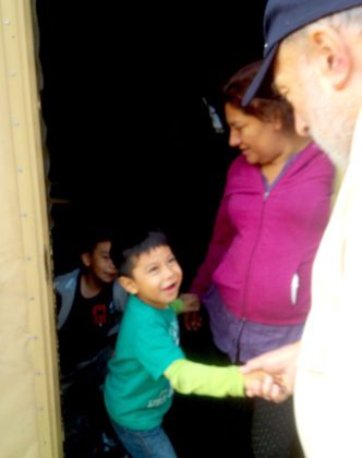 Fr. Tony visits with a young immigrant